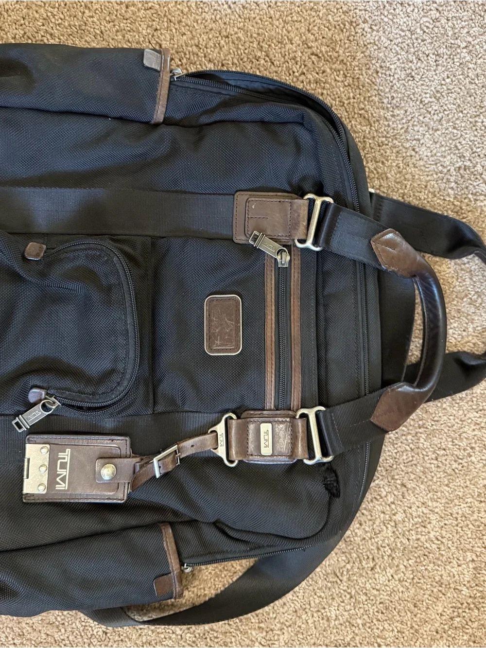 Tumi Black Backpack with Brown Leather Accents